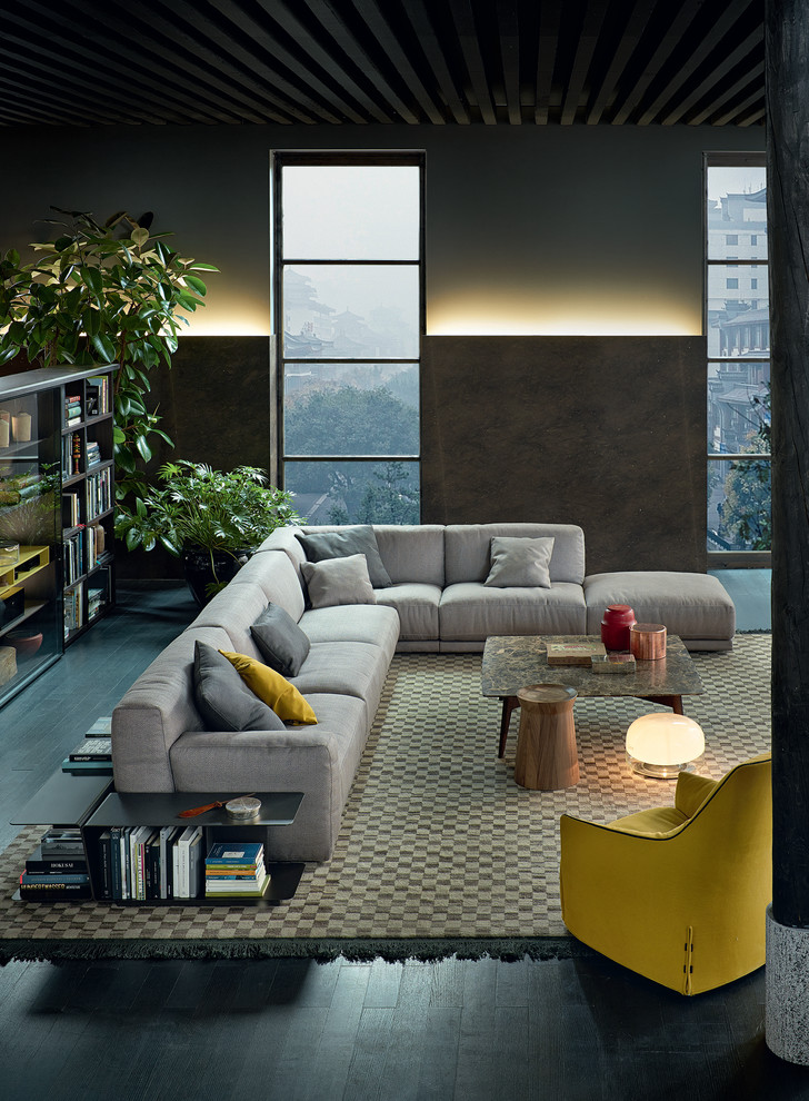 Immagine di un grande soggiorno minimal aperto con pareti grigie