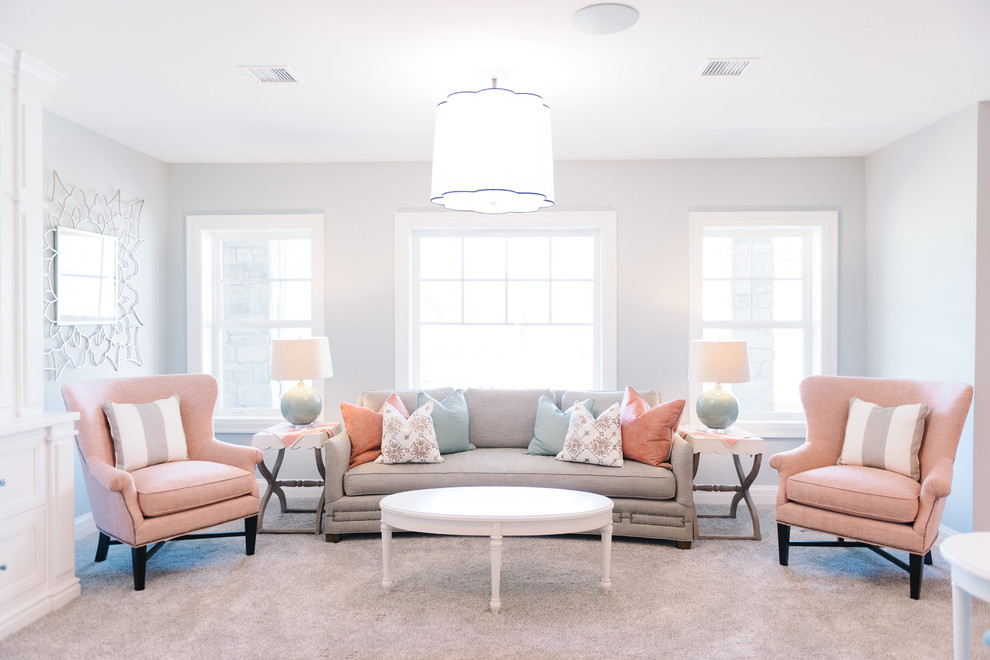 Photo of a traditional grey and pink living room in Salt Lake City with white walls and carpet.