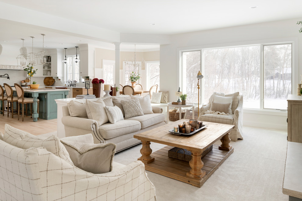 Example of a cottage open concept carpeted and beige floor living room design in Minneapolis with white walls, a standard fireplace and a stone fireplace