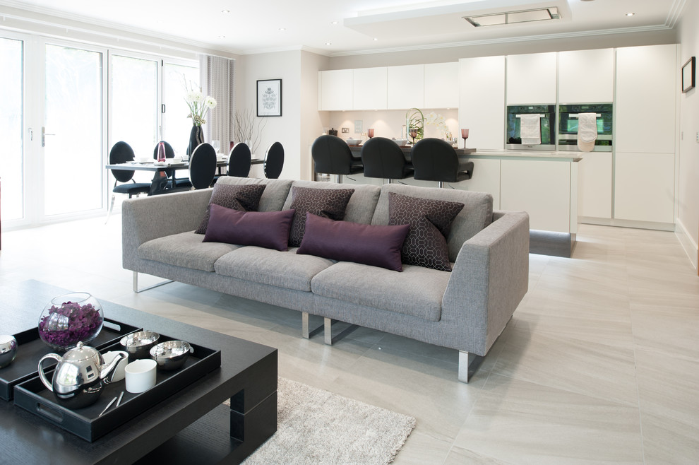 Living room - porcelain tile and gray floor living room idea in London