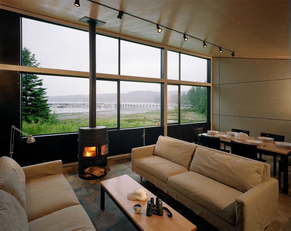 Design ideas for a modern living room in Seattle with a wood burning stove.