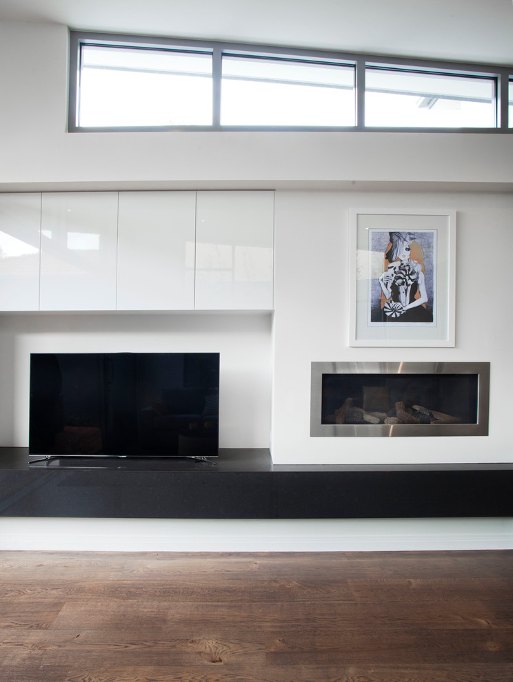 Photo of a medium sized modern open plan living room in Melbourne with white walls, dark hardwood flooring, a standard fireplace, a metal fireplace surround and a built-in media unit.