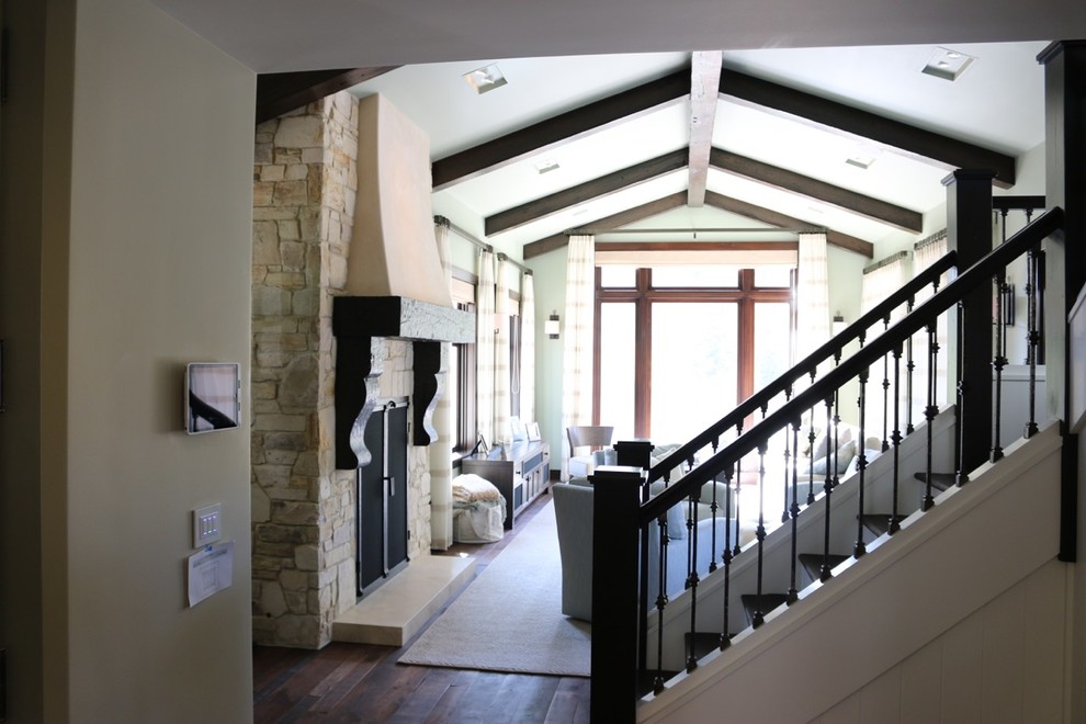 Example of a mid-sized farmhouse formal and enclosed dark wood floor living room design in Other with green walls, a standard fireplace, a stone fireplace and a tv stand