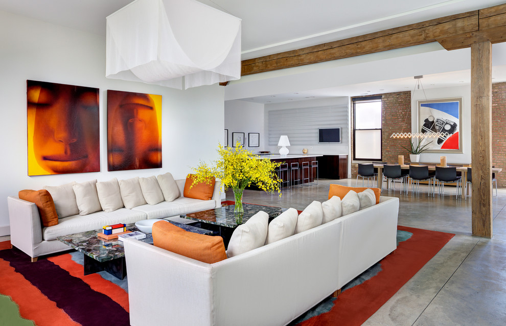 This is an example of a contemporary formal open plan living room in Chicago with white walls and concrete flooring.