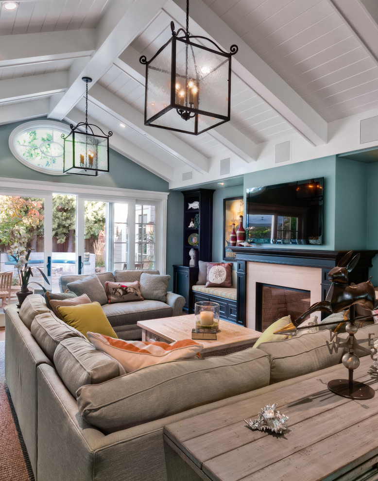 Living room - traditional living room idea in San Francisco with blue walls, a standard fireplace and a wall-mounted tv