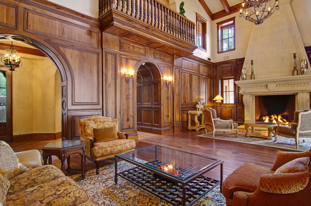 Imagen de salón para visitas abierto tradicional renovado extra grande con suelo de madera oscura y marco de chimenea de piedra