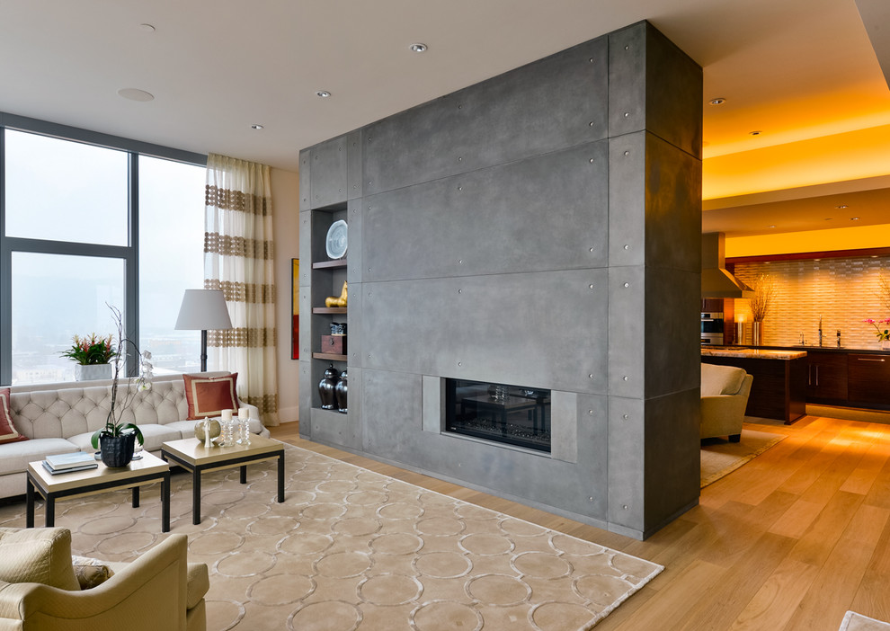 На фото: открытая гостиная комната в современном стиле с паркетным полом среднего тона, горизонтальным камином и фасадом камина из бетона