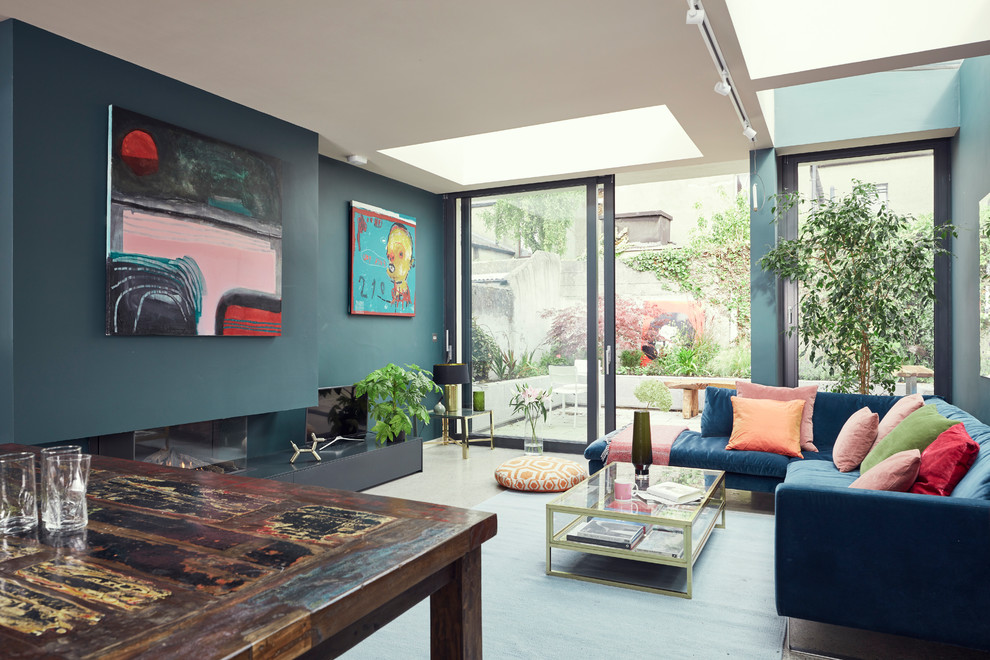 Photo of an eclectic living room in Dublin with green walls.