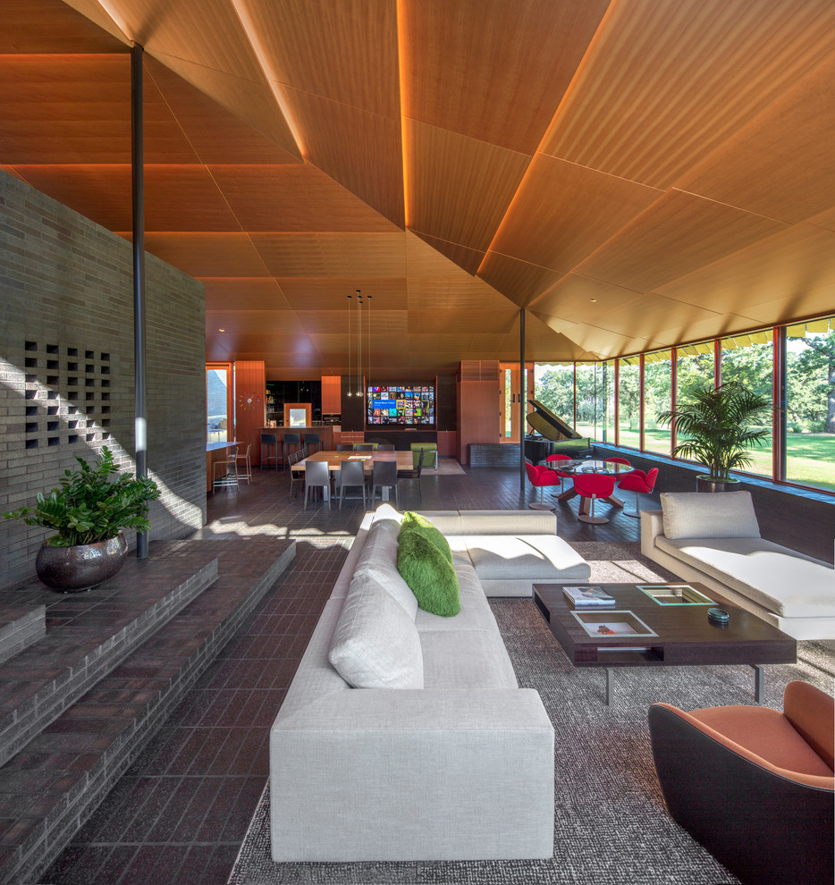 Idee per un soggiorno moderno aperto con pareti grigie, pavimento grigio e tappeto