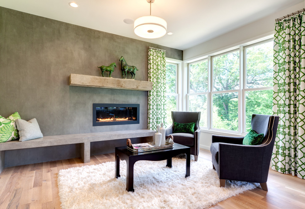 Example of a trendy open concept medium tone wood floor living room design in Minneapolis with gray walls, a ribbon fireplace and a metal fireplace