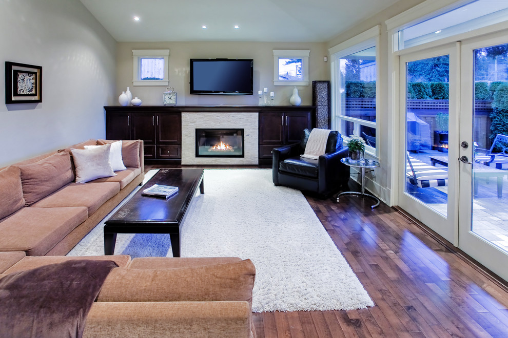 Inspiration for a contemporary enclosed living room in Vancouver with a wall mounted tv.