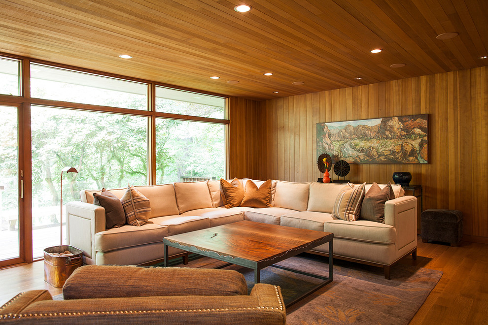 Idee per un soggiorno contemporaneo con pavimento in legno massello medio
