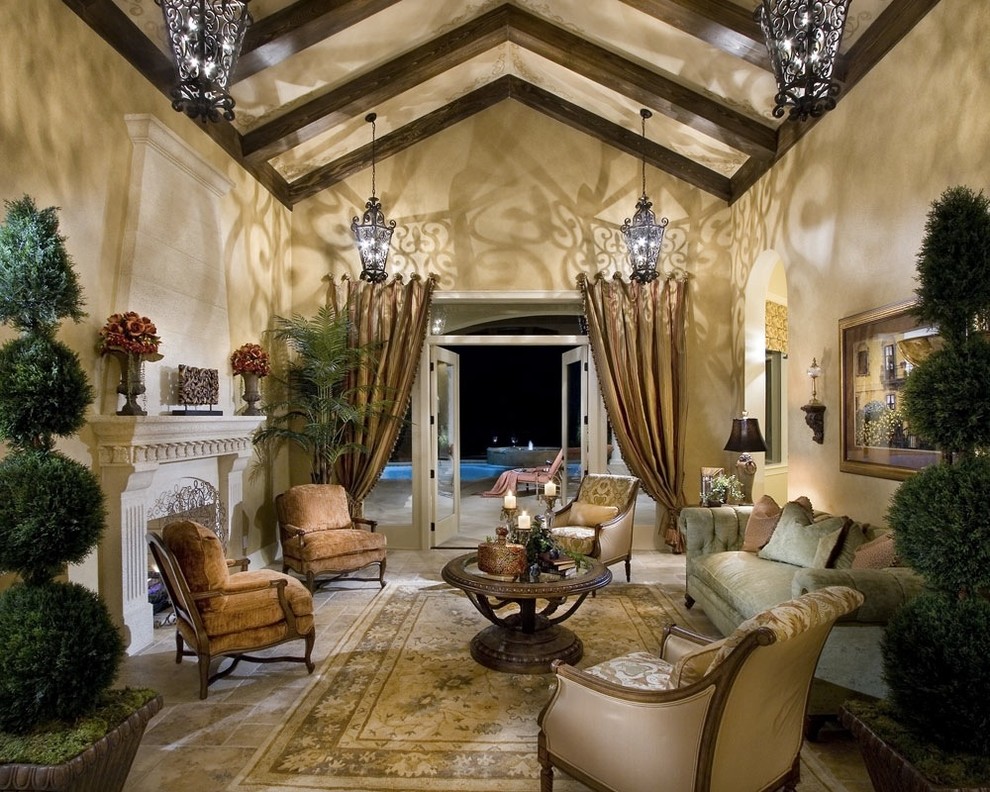 Inspiration for a large mediterranean formal and open concept travertine floor living room remodel in Orlando with beige walls, a two-sided fireplace and a stone fireplace