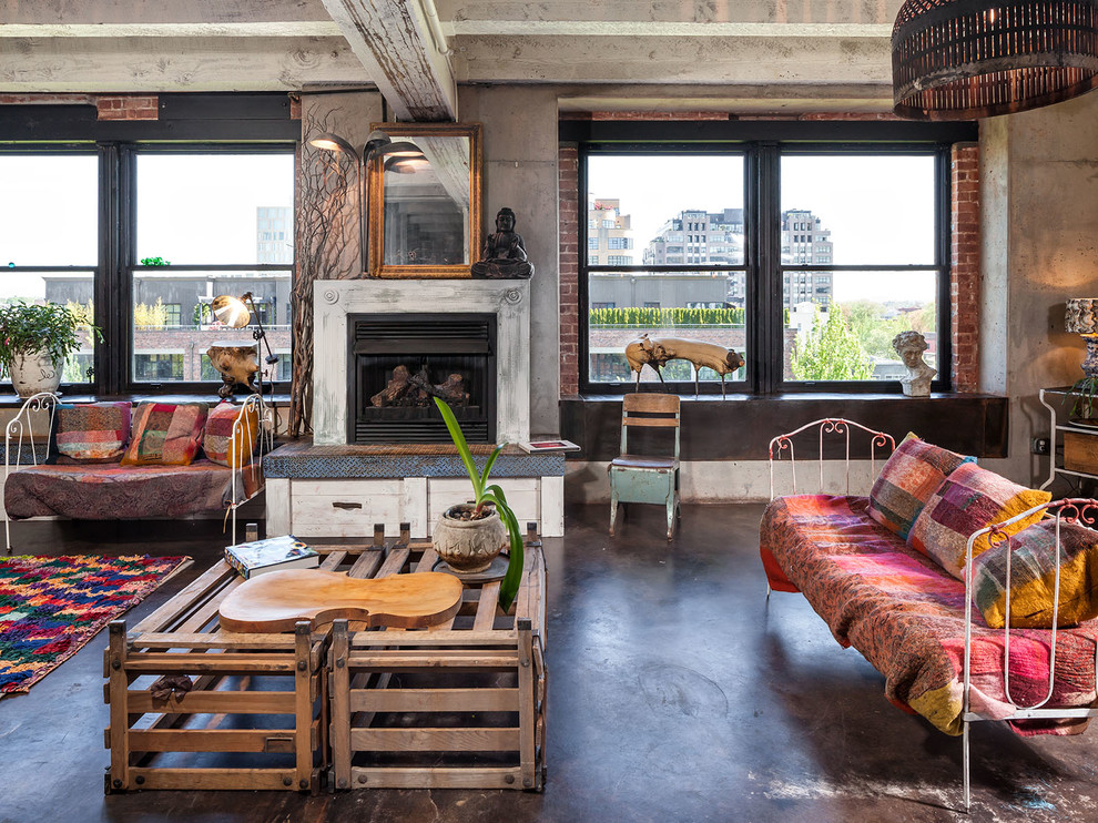 Living room - industrial open concept concrete floor living room idea in Portland with gray walls and a standard fireplace