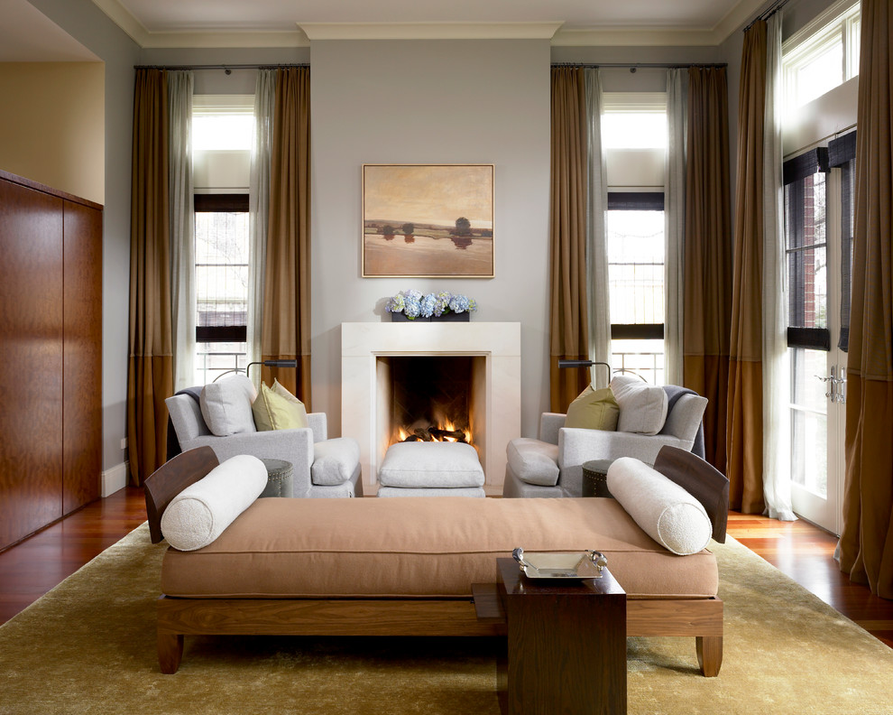 Classic formal living room in Chicago with grey walls and a standard fireplace.