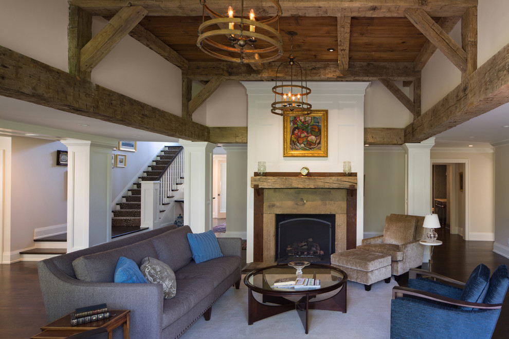 Example of a cottage formal and open concept dark wood floor living room design in Cleveland with beige walls and a standard fireplace