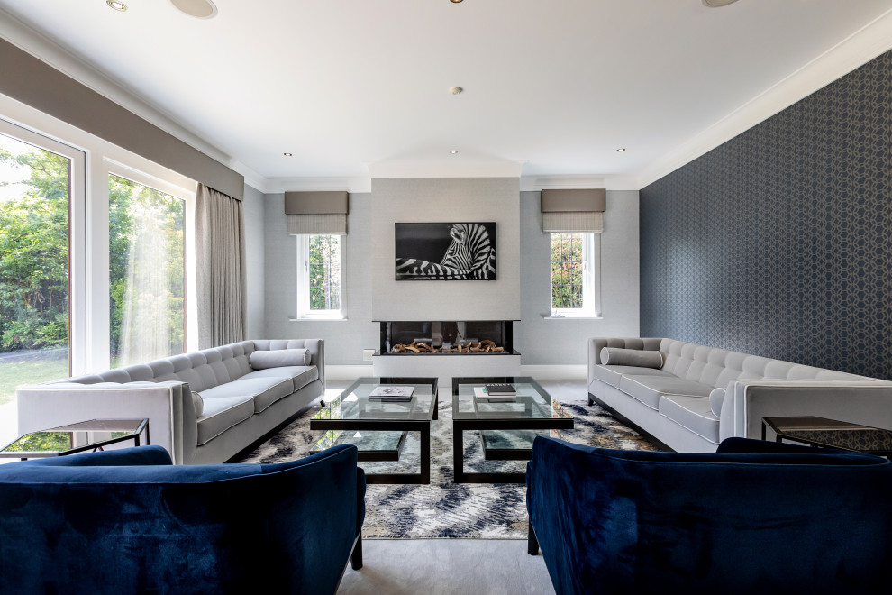 Trendy living room photo in Berkshire with gray walls, a ribbon fireplace and a wall-mounted tv