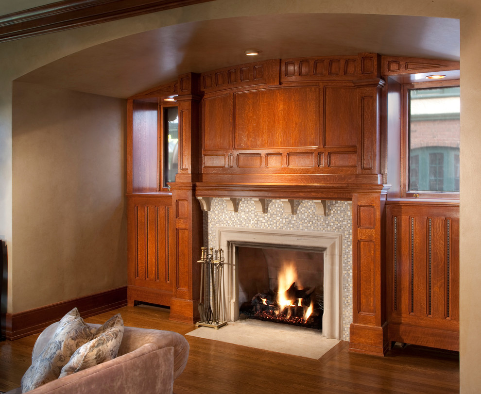 Design ideas for a classic formal living room in Milwaukee with beige walls, medium hardwood flooring, a corner fireplace and a wooden fireplace surround.