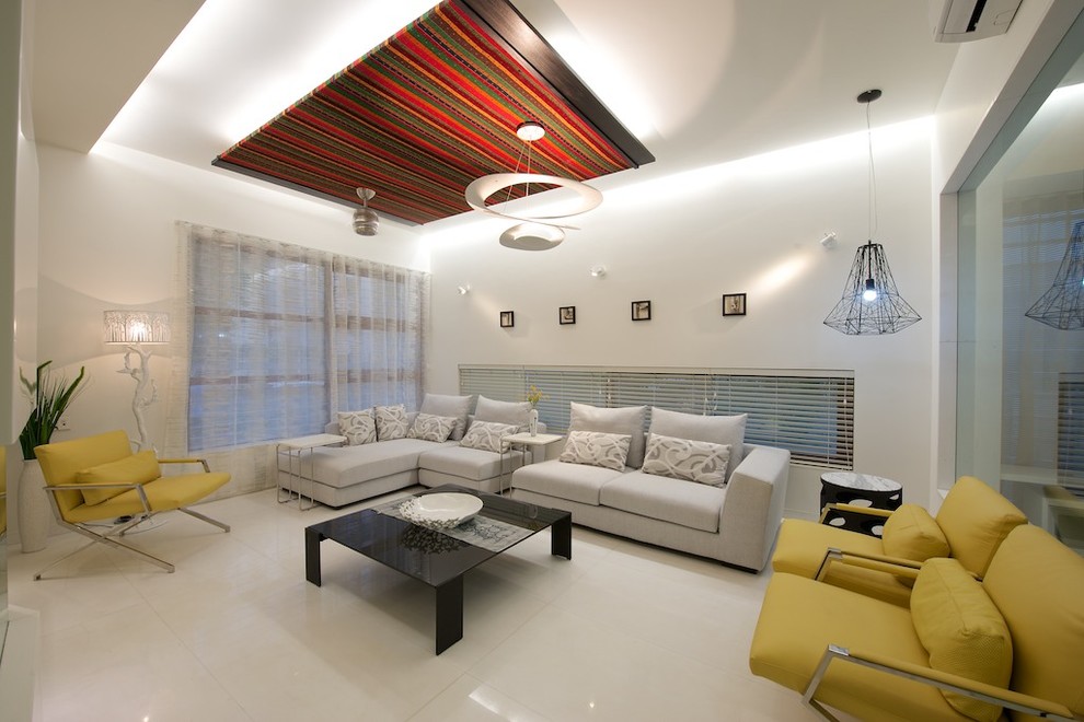 Inspiration for a modern living room in Ahmedabad with white walls.