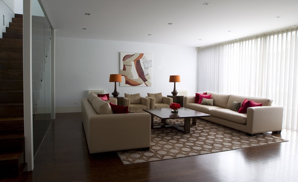 Photo of a large contemporary open plan living room in Melbourne with a reading nook, white walls and carpet.