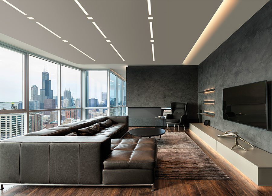 This is an example of a large modern open plan living room in Miami with black walls, dark hardwood flooring, no fireplace, a wall mounted tv and brown floors.