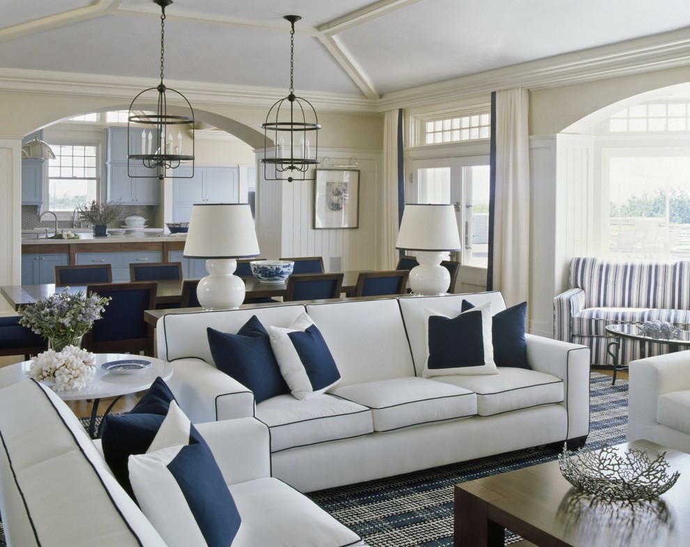 This is an example of a nautical formal open plan living room in New York with beige walls.