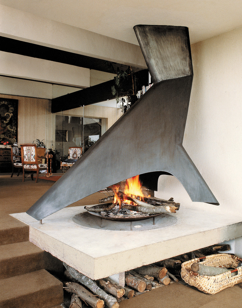 Example of a minimalist living room design in Toronto with white walls and a two-sided fireplace