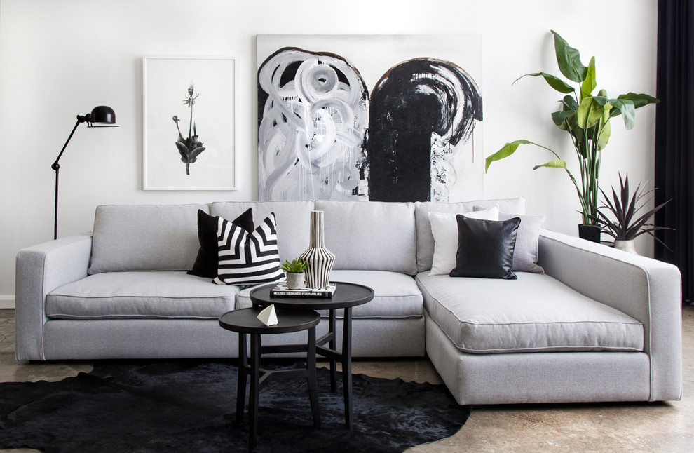 Immagine di un soggiorno minimalista di medie dimensioni con pareti bianche
