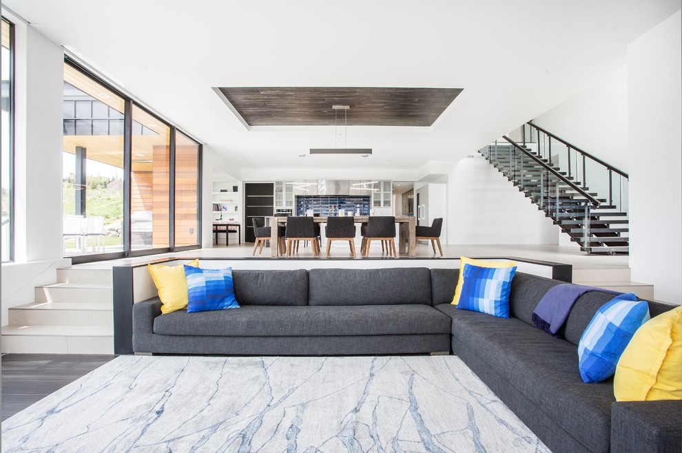 Inspiration for a contemporary open plan living room in Salt Lake City with white walls and grey floors.