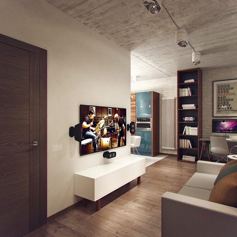 Cette image montre un petit salon minimaliste ouvert avec une salle de réception, un mur gris et un téléviseur fixé au mur.