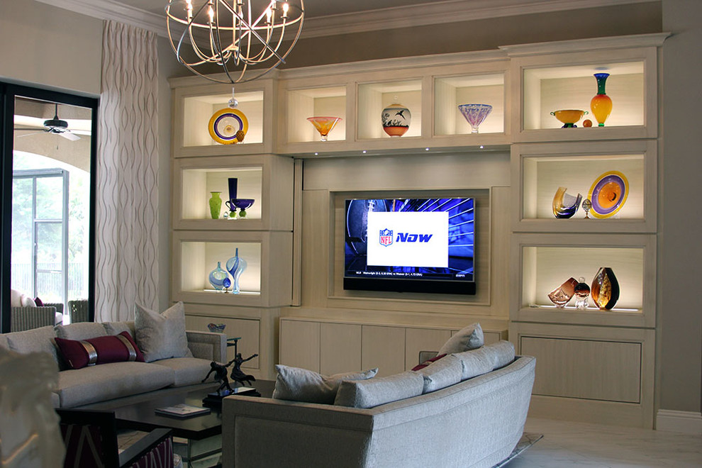 Example of a large minimalist open concept ceramic tile living room design in Miami with beige walls, a wall-mounted tv and no fireplace