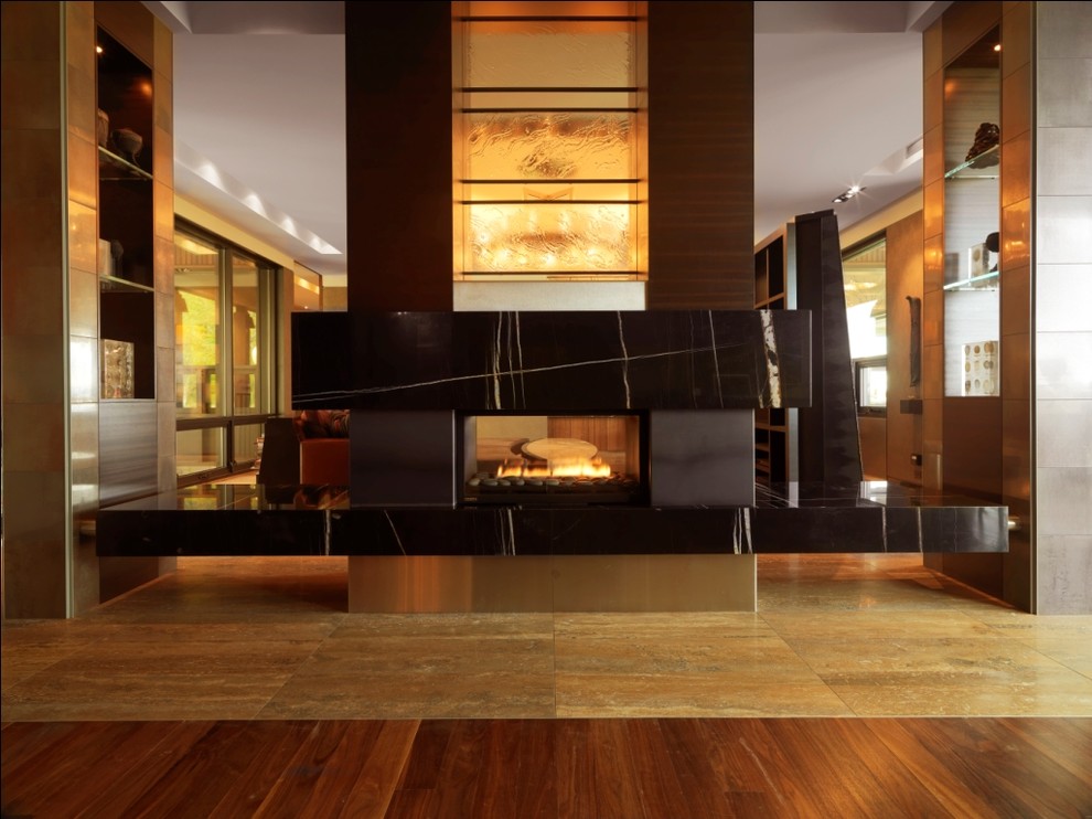 Example of a large mountain style open concept living room design in Burlington with a two-sided fireplace and a stone fireplace