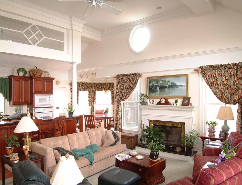 This is an example of a medium sized traditional open plan living room in Other with white walls, carpet, a standard fireplace, a metal fireplace surround and a home bar.