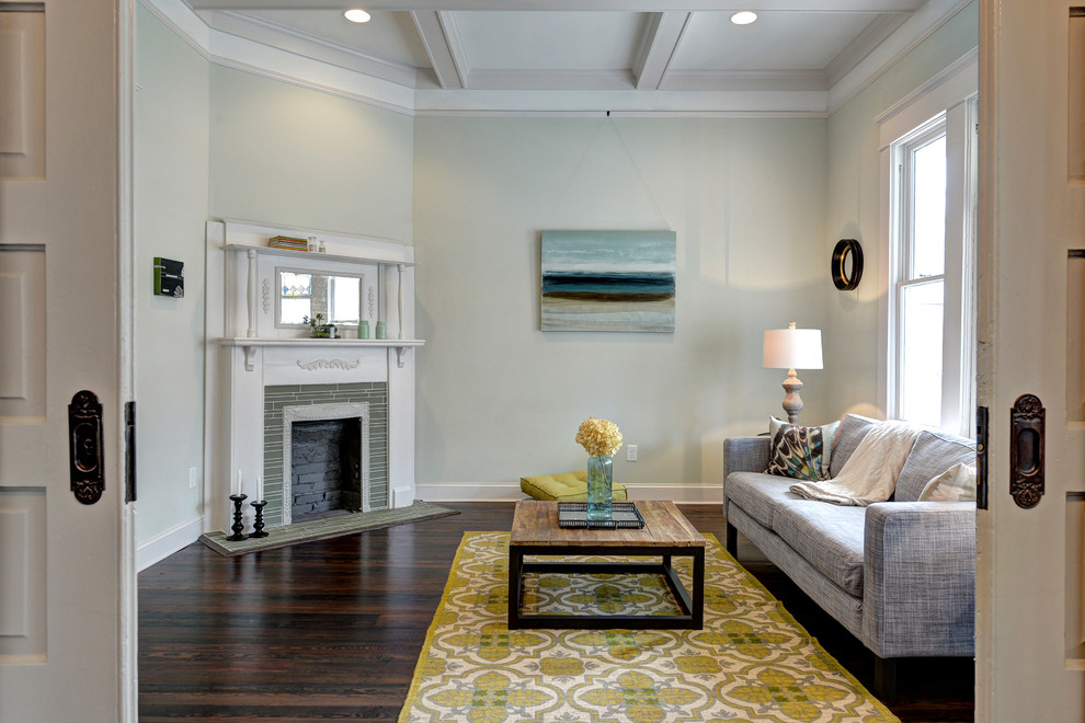 Example of a mid-sized classic dark wood floor living room design in Atlanta with green walls, a corner fireplace and a wood fireplace surround