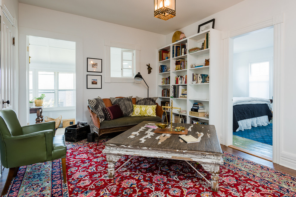 Photo of a medium sized bohemian formal enclosed living room in Boston with white walls.