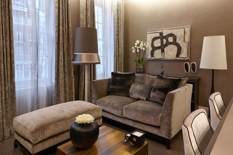 Small trendy open concept medium tone wood floor living room photo in London with beige walls