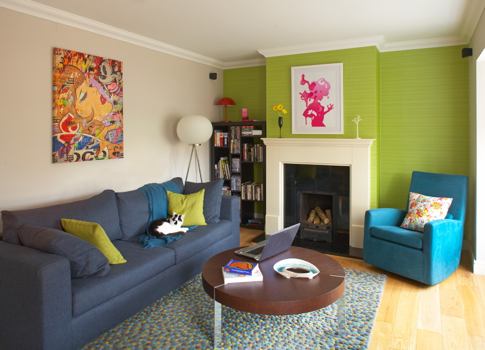 Inspiration for a medium sized eclectic enclosed living room in Dublin with a standard fireplace.