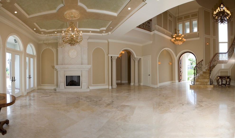 Ejemplo de salón para visitas clásico sin televisor con paredes beige, suelo de mármol, todas las chimeneas y marco de chimenea de piedra