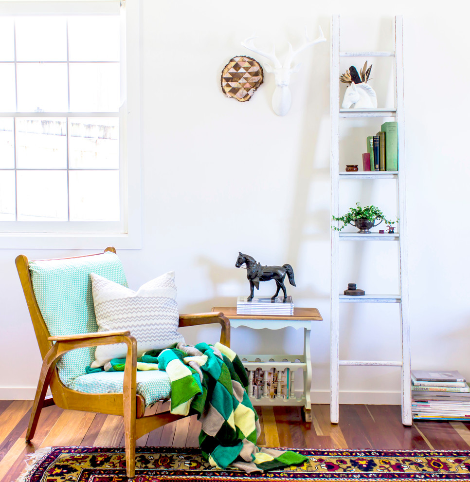 Inspiration for a large eclectic open concept dark wood floor living room remodel in Brisbane with white walls