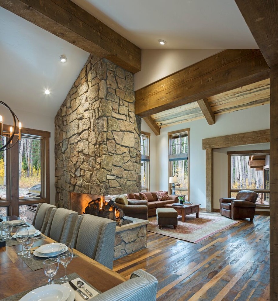 Living room - mid-sized rustic open concept dark wood floor living room idea in Denver with white walls, a standard fireplace and a stone fireplace