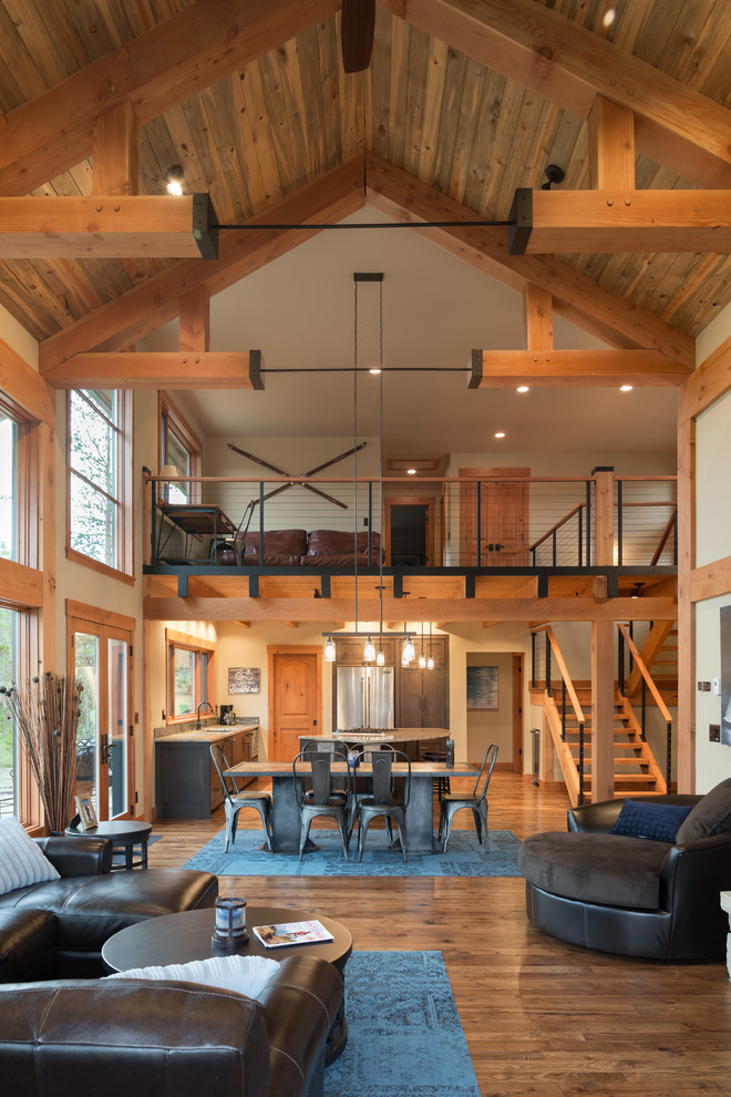 Medium sized rural open plan living room in Denver with no tv, beige walls and medium hardwood flooring.