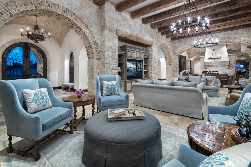 Photo of a large mediterranean open plan living room in Austin with a built-in media unit.