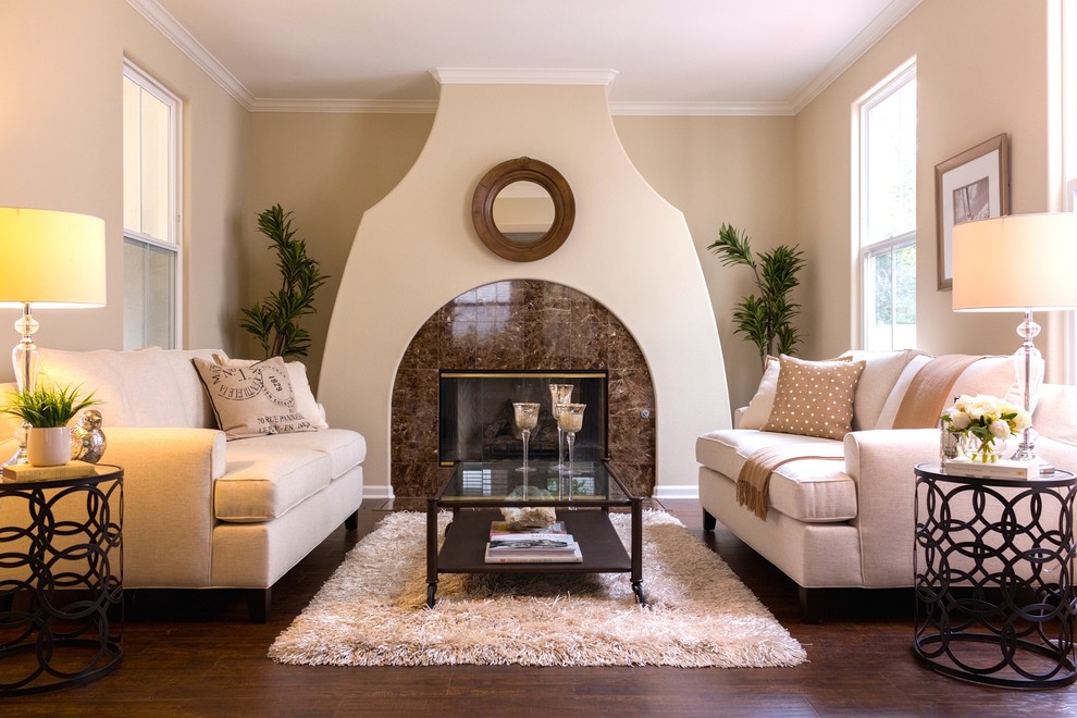 Example of a mid-sized tuscan formal and open concept medium tone wood floor living room design in San Diego with white walls, a standard fireplace and a tile fireplace
