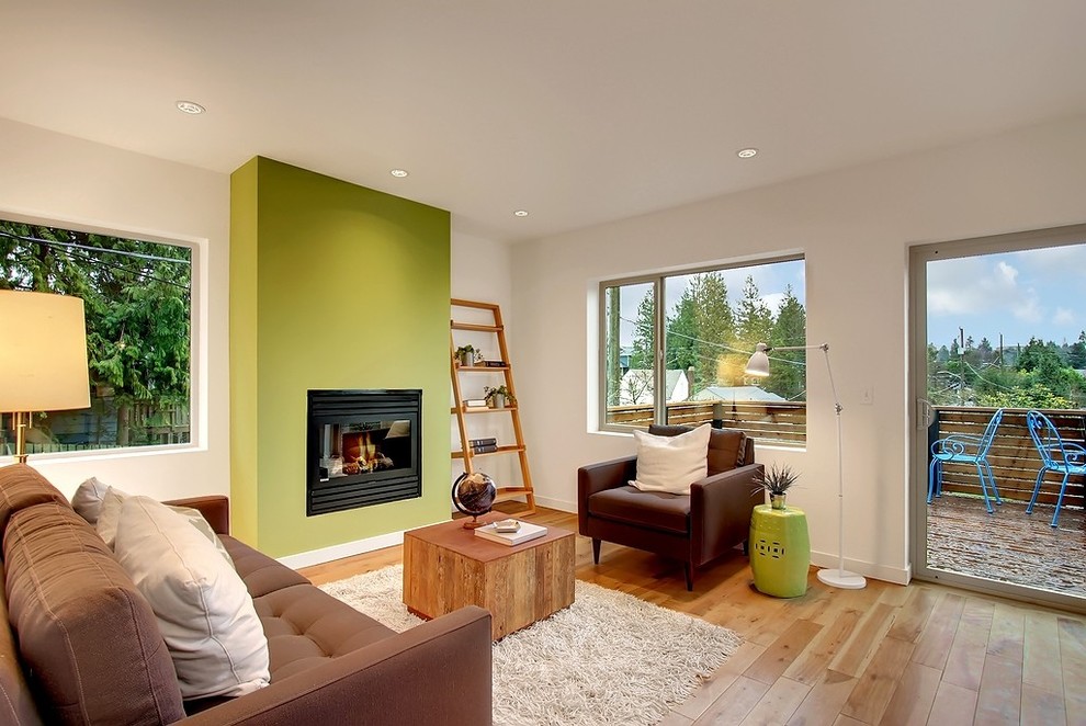 Contemporary living room feature wall in Seattle with green walls.