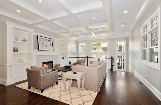 Photo of a medium sized contemporary formal open plan living room in Chicago with grey walls, medium hardwood flooring, a standard fireplace and a wooden fireplace surround.
