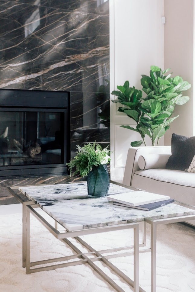 Inspiration for a large modern formal open plan living room in Vancouver with white walls, marble flooring, a standard fireplace, a tiled fireplace surround, no tv and white floors.