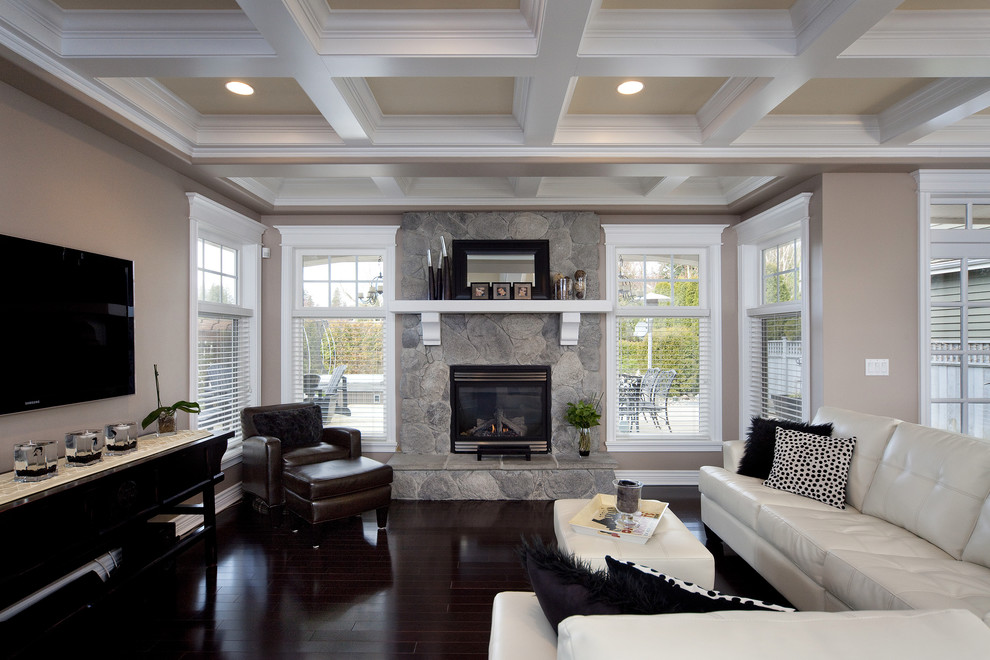 Example of a trendy living room design in Vancouver with a stone fireplace