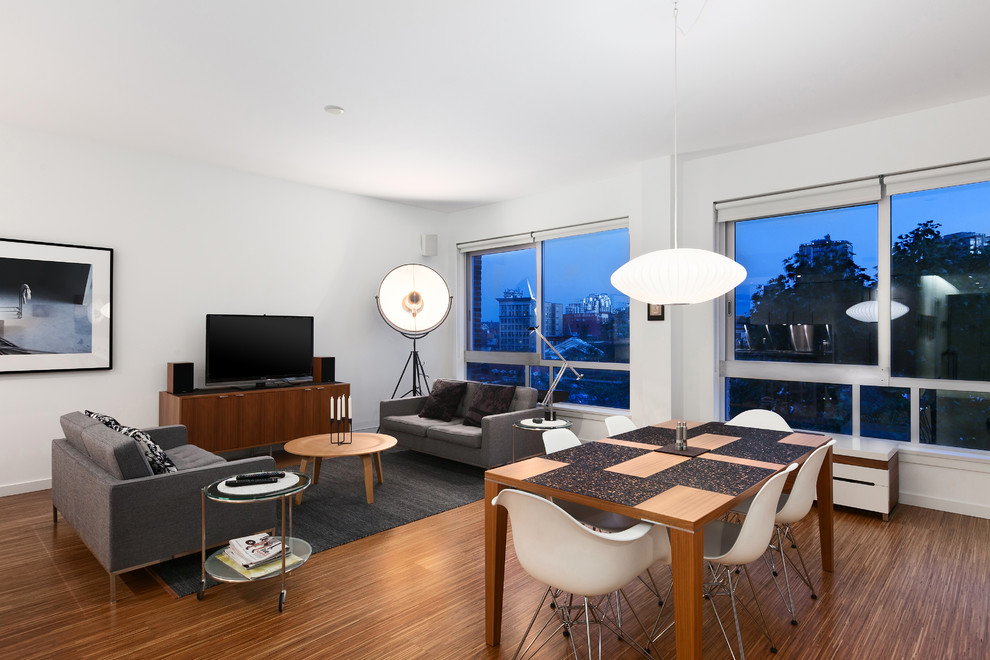 Example of a minimalist living room design in Vancouver with white walls