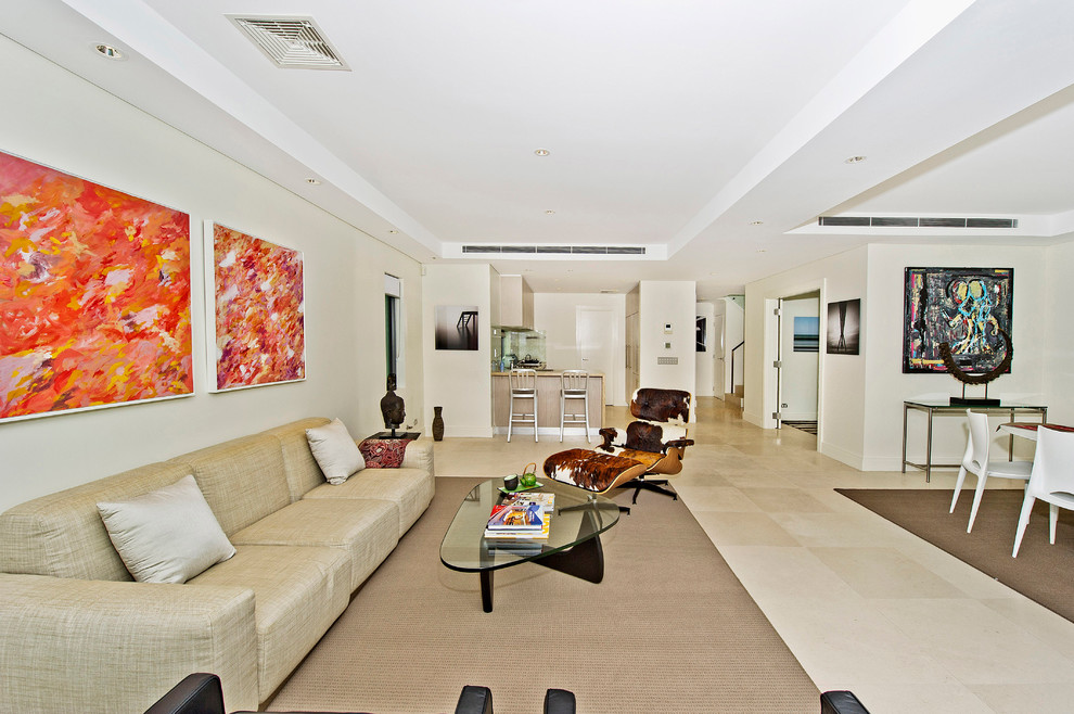 Идея дизайна: гостиная комната среднего размера в современном стиле с белыми стенами и полом из известняка без камина, телевизора