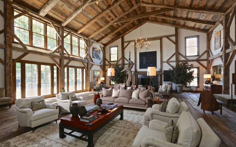 Inspiration for a rustic living room remodel in New York with white walls